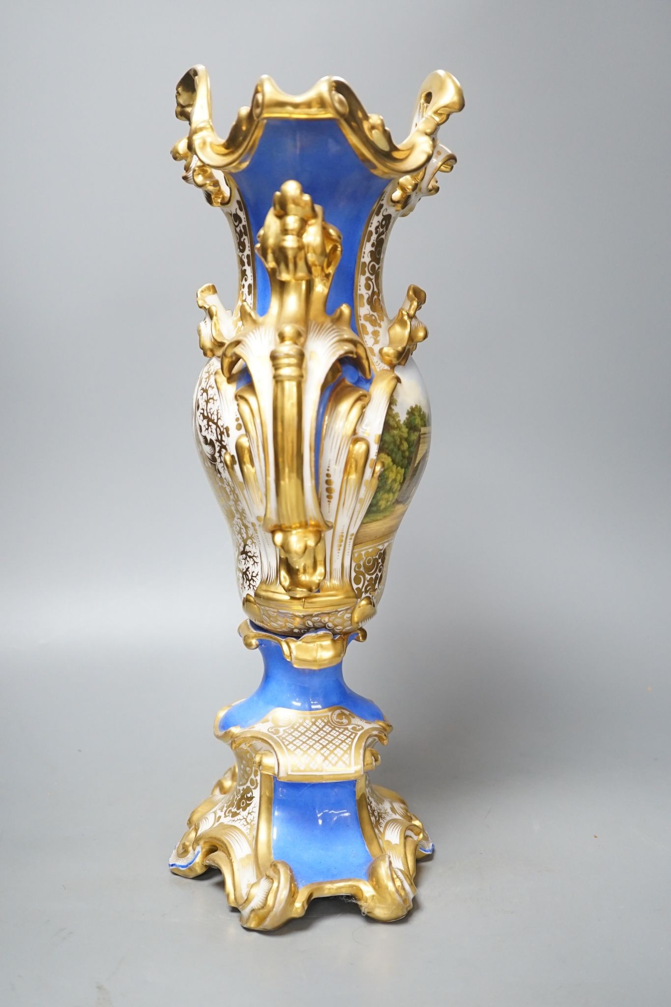 An early 19th century Paris porcelain vase in Feuillet style painted with a folly 44cm